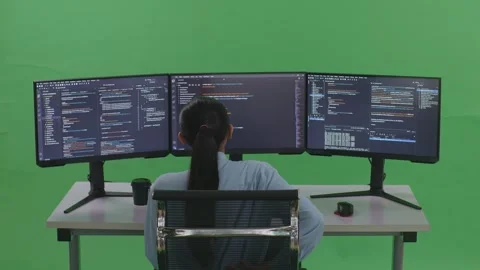 Woman Developer Having Backache While Write Code With Multiple Computer Screens Stock Footage 252565040