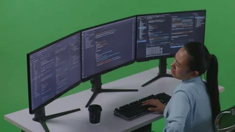 Woman Developer Having Backache While Write Code With Multiple Computer Screens Stock Footage 252578433