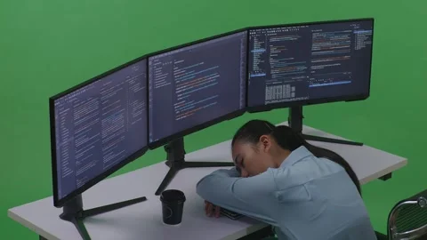 Woman Developer Sleeping While Write Code With Multiple Computer Screens Stock Footage 252579095