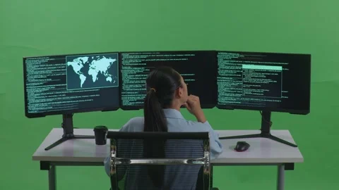 Woman Developer Thinking About Something While Write Code With Multiple Computer Stock Footage 252567091