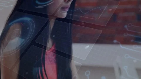 Woman developer typing on laptop and activating hologram charts and code while Stock Footage 333902402