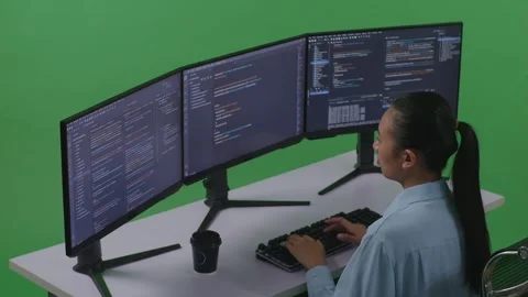Woman Developer Using Computer To Write Code With Multiple Screens Green Screen Stock Footage 252577450