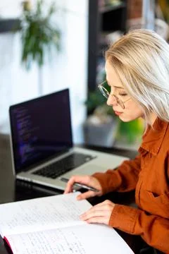 Woman developer working with computer at home office Foto stock