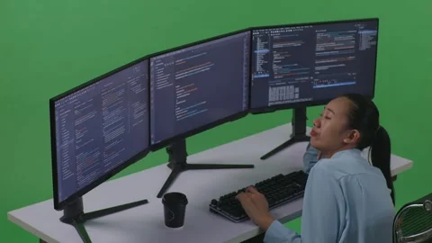 Woman Developer Write Code With Multiple Computer Screens In Green Screen Studio Stock Footage 252578552