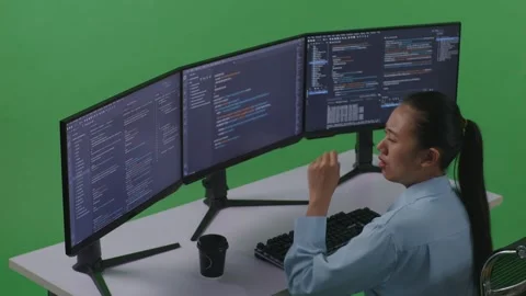Woman Developer Yawning Before Sleeping While Write Code With Multiple Computer Stock Footage 252578933