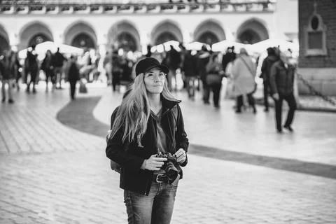 Woman with digital compact camera Stock Photos