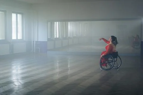 Woman with a disability, a para dancer practicing choreography at the dance Stock Photos