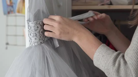 A woman disassembles things in a little daughter's closet Stock Footage 143656080