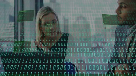 Woman discussing IT data after turquoise 01 stream appearing, man replying as Stock Footage 332981642