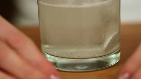 Woman Dissolving Effervescent Table Видео 56078240