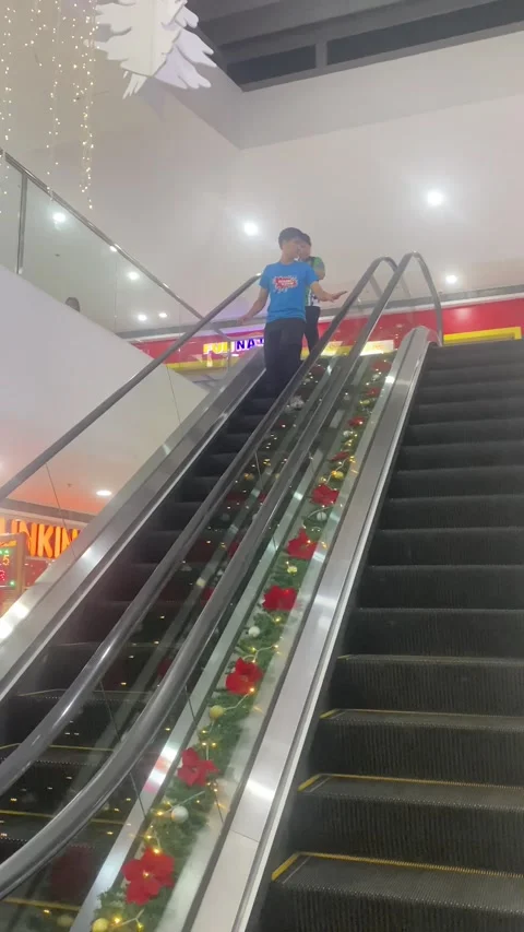 Woman Distracted By Receipt Doesn't Move On Broken Escalator, Philippines - 07 D Stock Footage 323871978