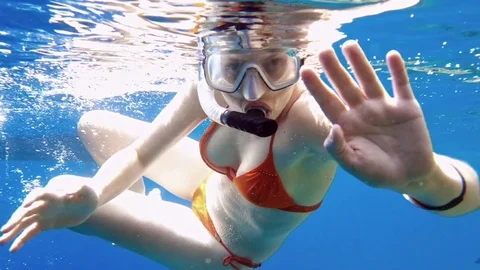 Woman dive underwater in snorkeling diving mask Stock Footage