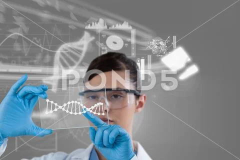 Woman doctor watching DNA graphics Stock Photos
