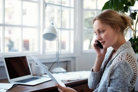 Woman, document and remote work in home with phone call, reading or report for Stock Photos