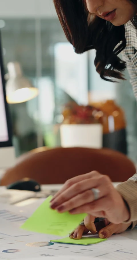 Woman, documents and data analysis in office with sticky note, sales performance Stock Footage 336774785