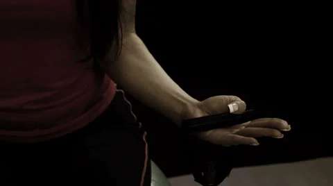 A woman does arm curls with exercise bands Stock Footage 33831397