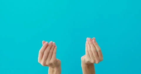 Woman does asking money gestures by hands on turquoise 動画素材 150623341