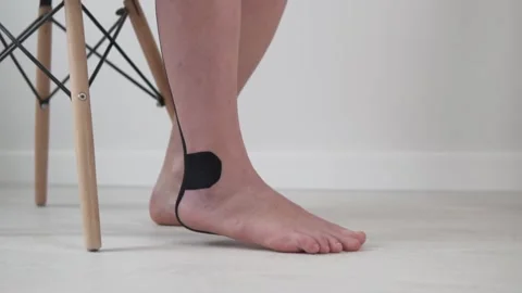 A woman does an exercise to develop a foot, close-up of the foot Video stock 154082520