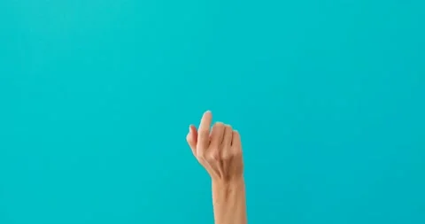 Woman does inviting gestures by elegant finger on turquoise 動画素材 150624214