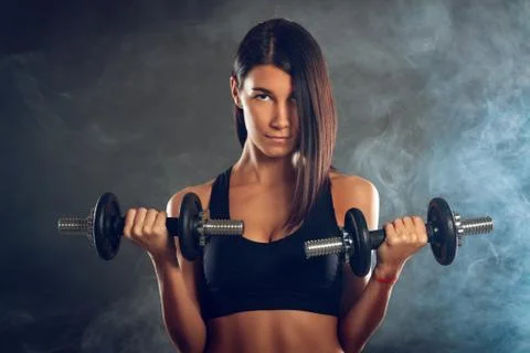 Woman Doing Biceps Exercise Stock Photos