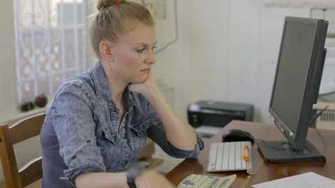 Woman doing budget at computer Stock Footage 89558985