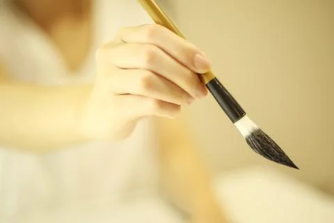 Woman doing calligraphy Stock Photos