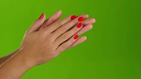 Woman doing claps her hands on a green screen background Stock Footage