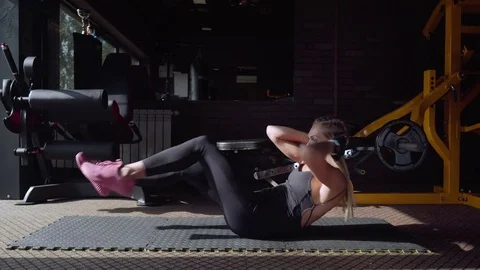 Woman doing crunch exercise Stock Footage