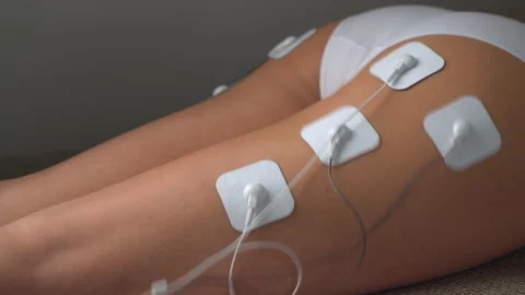 Woman doing electrical stimulation massage on the Buttocks Tens. Stock Footage 150171441