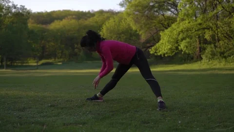 Woman Doing Exercise the Slopes Early in the Morning in the Spring Stock Footage 75320369