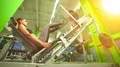 The woman doing exercise in a sport club on a bright light background 4k or 4k+ Resolution