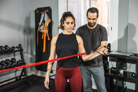 Woman doing functional training with personal trainer Stock Photos