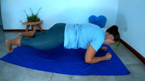 Woman doing home exercise during quarantine Stock Footage 128154824