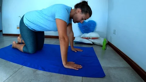 Woman doing home exercise during quarantine Stock Footage 128155057