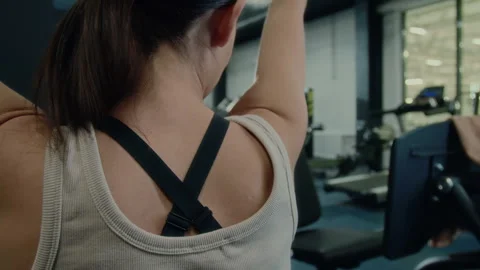 Woman Doing Lat Pulldowns on Gym Machine Stock Footage 285657763