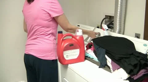 Woman Doing Laundry Видео 12616588