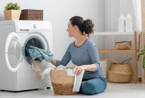 Woman is doing laundry Stock Photos
