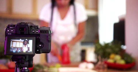 Woman doing live stream while cooking fruits, medium shoot Stock-Footage 142580868