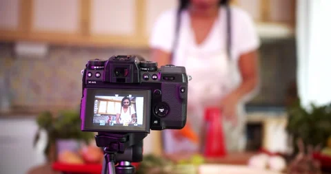Woman doing live stream while cooking fruits, medium shoot Stock-Footage 142582292