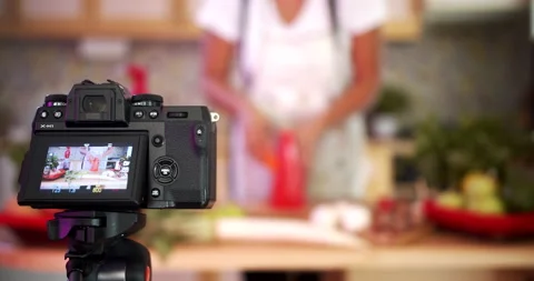 Woman doing live stream while cooking fruits, medium shoot Stock Footage 142586280