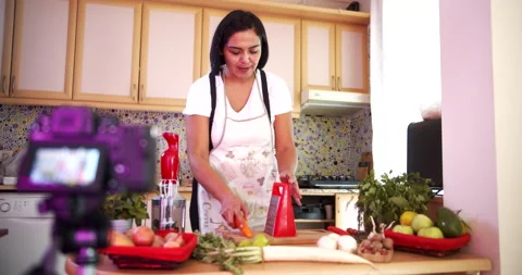 Woman doing live stream while cooking fruits, wide shoot Stock-Footage 142587275