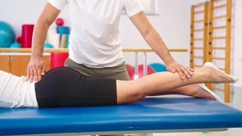 Woman doing lower back exercises 스톡 동영상 161641582