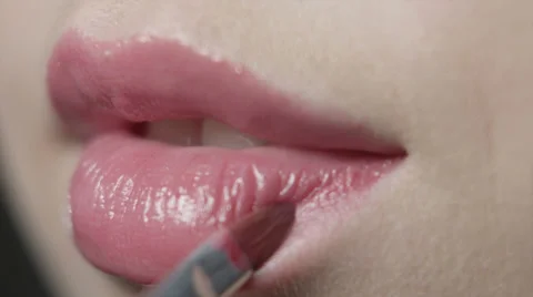 Woman doing makeup lips close up Stock Footage