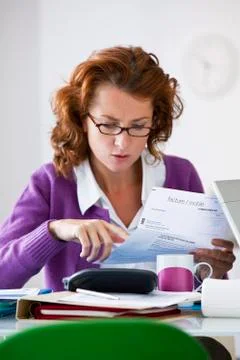 Woman doing paperwork Stock Photos