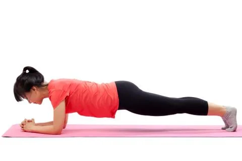 Woman doing plank exercise Stock Photos