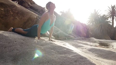 Woman doing push up exercise on rock Video stock 71546247