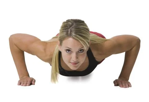 Woman doing a push-up Foto stock