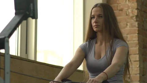 Woman Doing Rowing Machine Workout Video stock 101144998