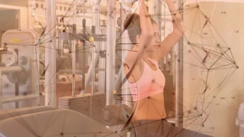 Woman doing seated cable pull at fitness gym changing grip, pulling load, grid Stock Footage 329533730