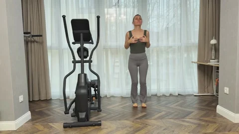 Woman doing small repeated jumps in place at home, Concept of low impact cardio 스톡 동영상 341866649